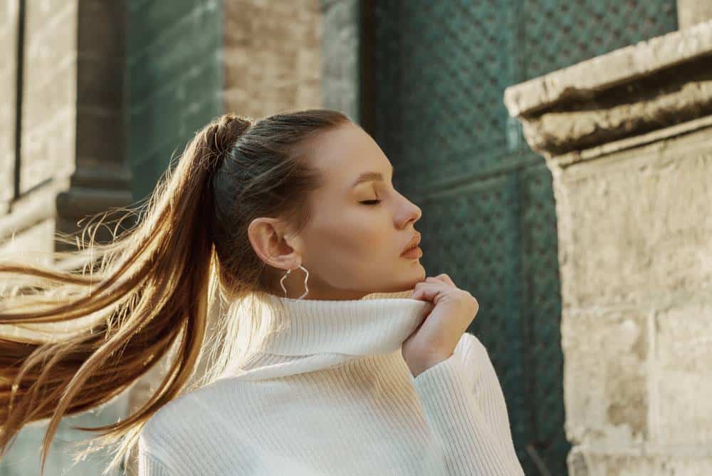 A beautiful young woman with a long ponytail