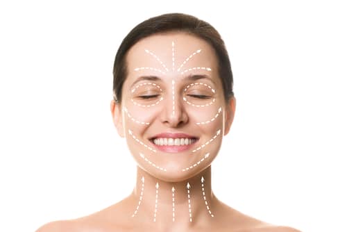 A beautiful young woman with a face marked for a facelift.