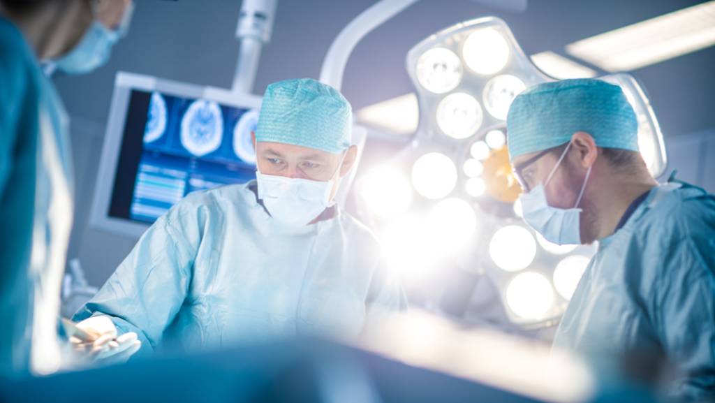 Doctors working on a patient in an operating room