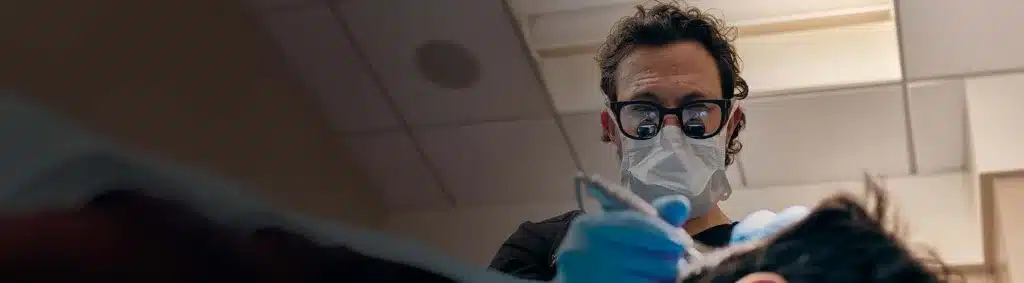 Picture of Dr. Andrew Jacono in Scrubs During Surgery