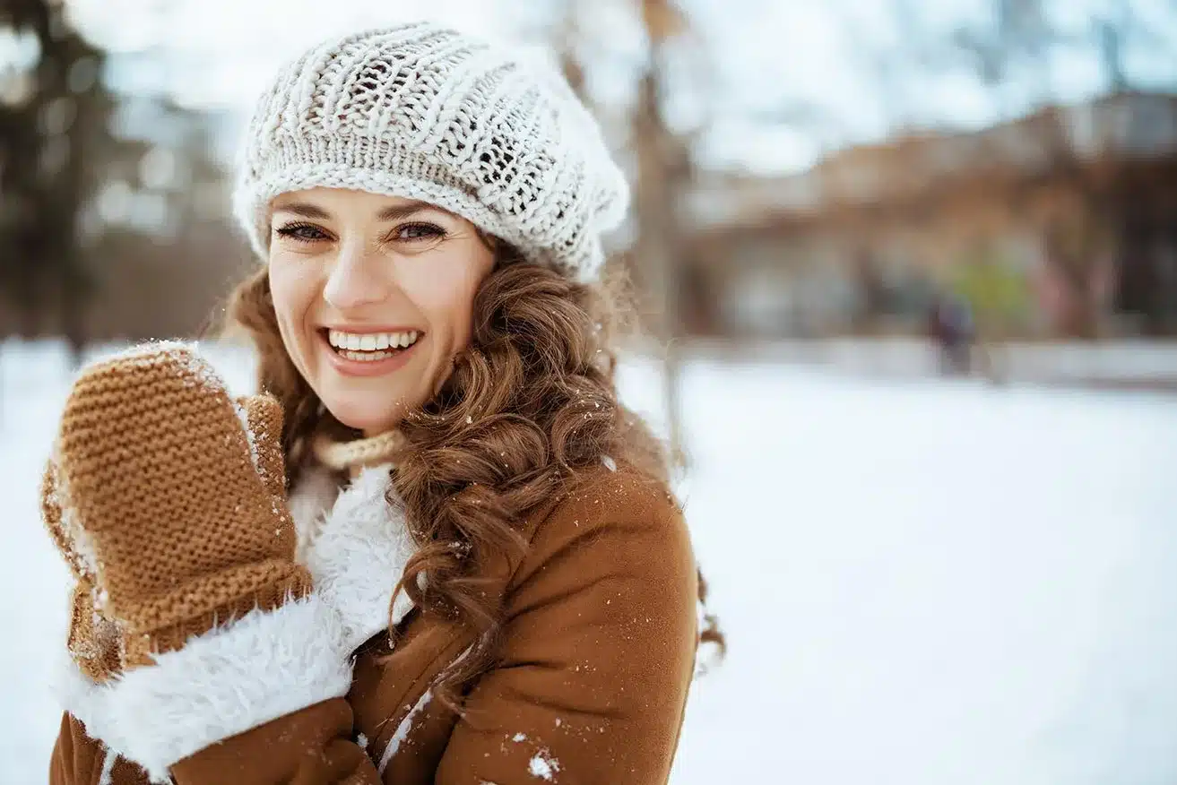 smiling woman in the snow jpg
