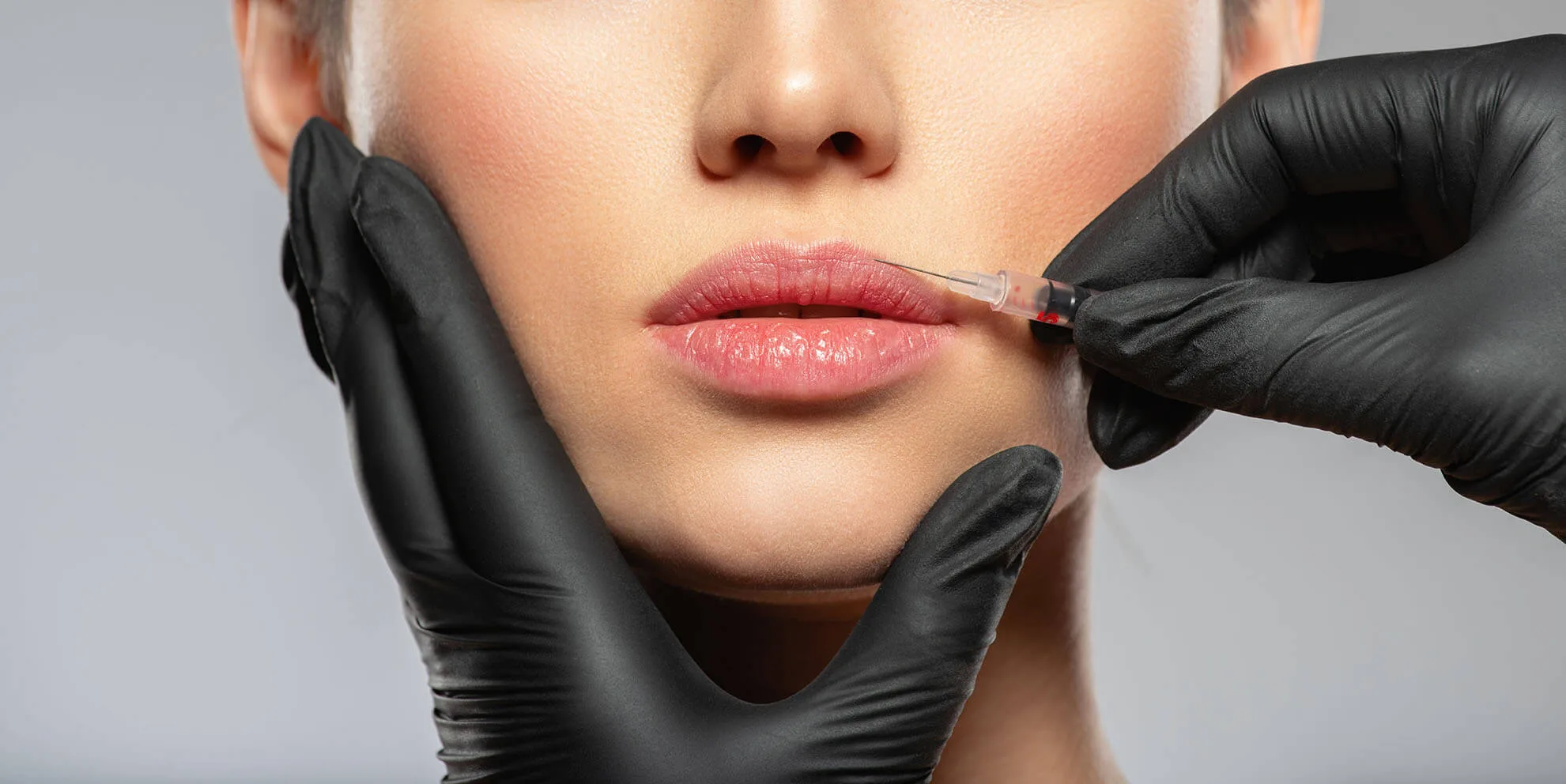 A woman getting botox in her lip