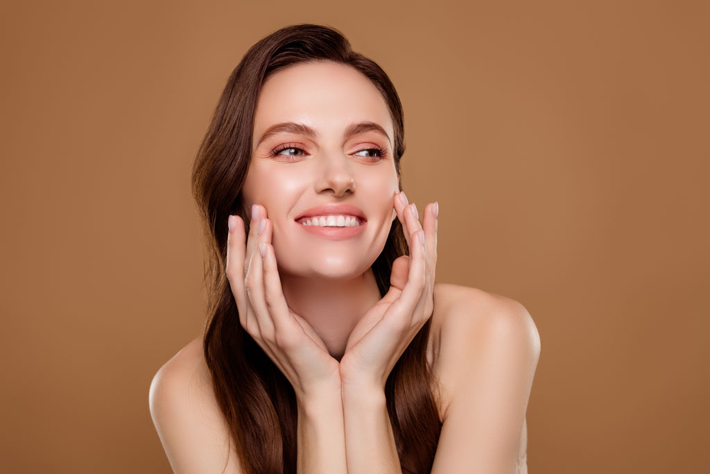 A beautiful woman touching her face