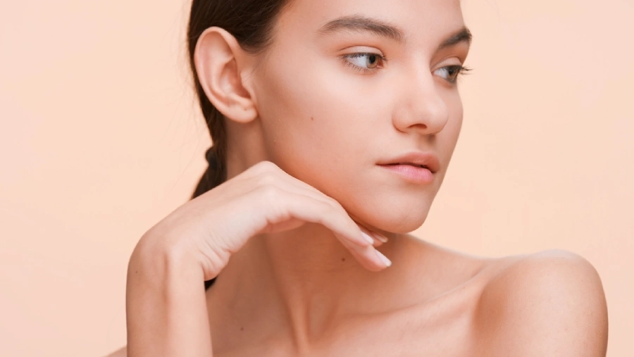 A beautiful woman with her jaw resting on her hand