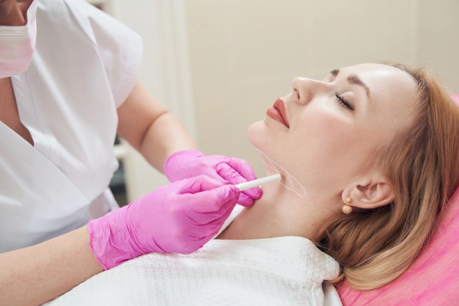 A woman preparing for neck lift surgery
